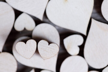 valentine wooden hearts on bokeh background
