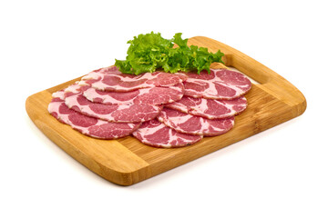 Coppa Ham Slices with Lettuce on Wood, isolated on white background
