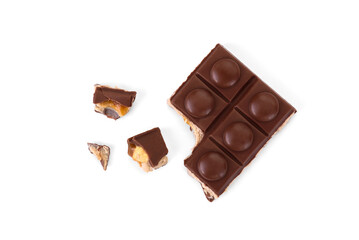 Chocolate bar with caramel, nougat and nuts filling isolated on white background.