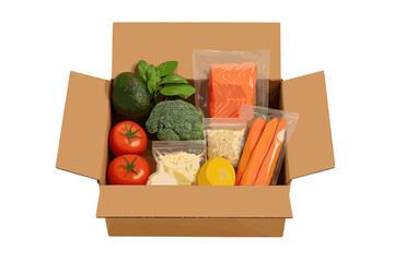 Healthy meal kit ingredients packed in a brown cardboard delivery box on a white background