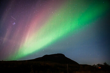 Northern lights in night sky over Saana in Kilpisjärvi Finland