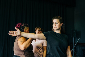 Women rehearsing movement in a dance studio
