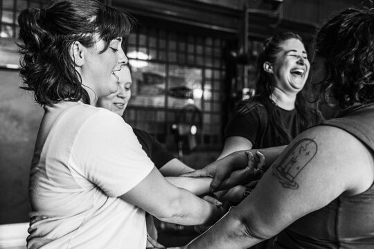 Group shares laughter during team-building exercise