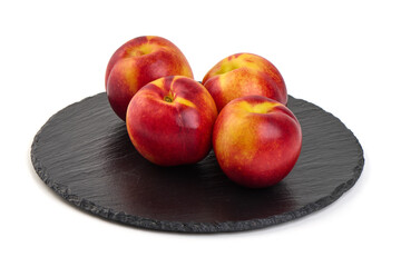 peaches on a plate, isolated on white background
