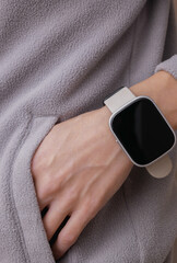 Fototapeta premium Workout accessories. Smart bracelet on a fitness woman's wrist. Active lifestyle, sport outfit