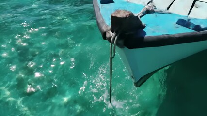 Freshwater boat gliding peacefully on calm blue water, capturing the serene concept of quiet contemplation and introspection, perfect for stock media buyers looking to convey a sense of.