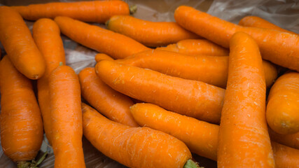 Fresh orange carrots close-up texture