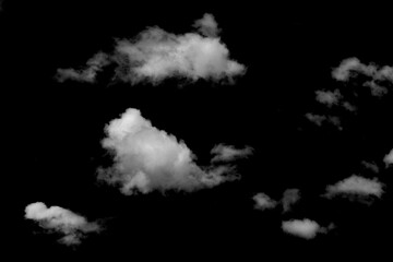 Realistic isolated clouds on black background with off-white texture, natural fluffy shapes and atmospheric effects, perfect for design.