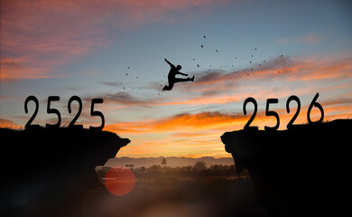 Silhouette man jumping over cliffs for I can do it, good mindset, freedom, good mindset, photo, poster, conceptual art, success, goals