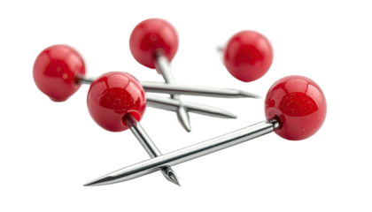 Shiny red push pins scattered on a dark background