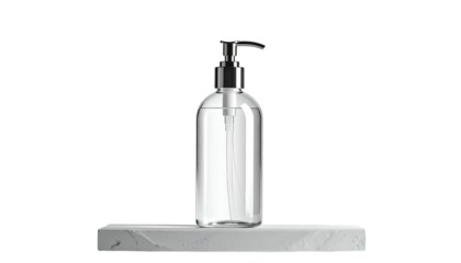 Clear liquid dispenser sits on textured, white stone slab