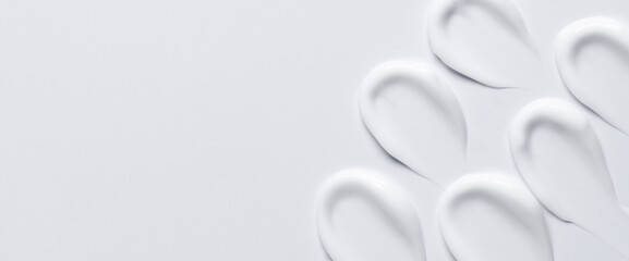 A sample of a white moisturizing cosmetic cream for the body or face with salicylic acid