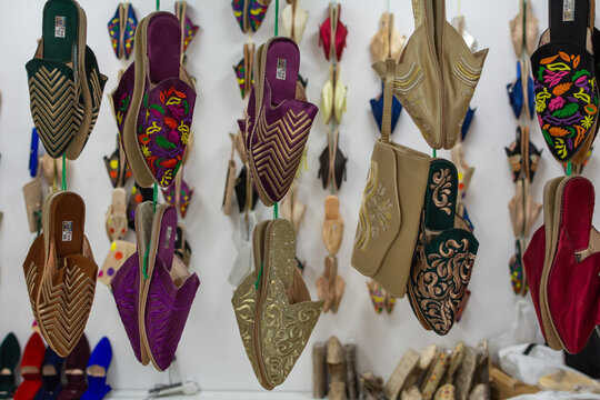 Colorful collection of traditional Moroccan babouche slippers on display at the Sheikh Zayed festival 2025-2026.