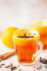 Black tea brewed in orange zest. Citrus hot drink