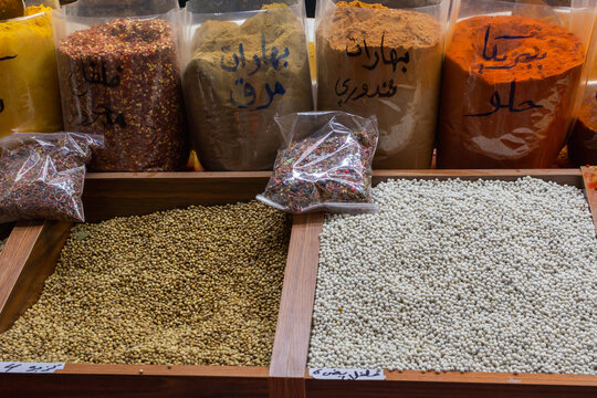 A vibrant display of whole spices, powders, and seasonings at a market stall during the Sheikh Zayed festival 2025-2026 in Al Wathba, Abu Dhabi. - Powered by Adobe