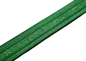 Intricate green patterned border against dark, angled view