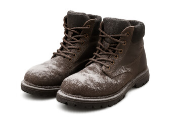 Pair of brown leather winter boots covered in snow, ready for cold weather activities, on transparent background