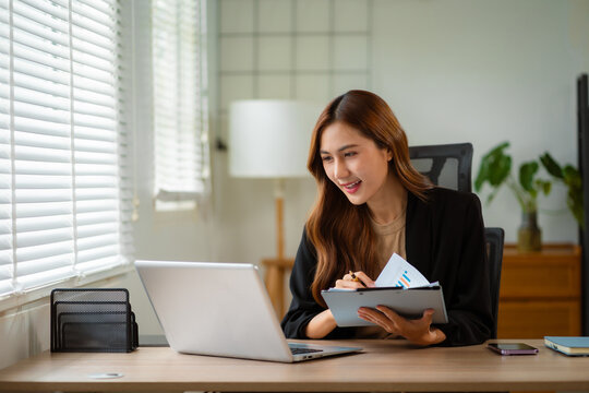 women doing finances and calculate on desk about cost at home office.