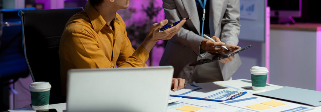 Businessmen team or financial data analysts working with tablets and laptop computers and data graphs together. Plan to analyzing projects in the office.