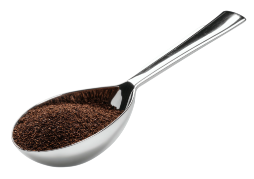 Shiny metal spoon filled with dark ground coffee