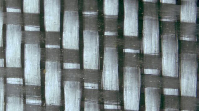 Fiberglass twill weaves under microscope