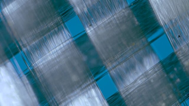 Fiberglass twill weaves under microscope
