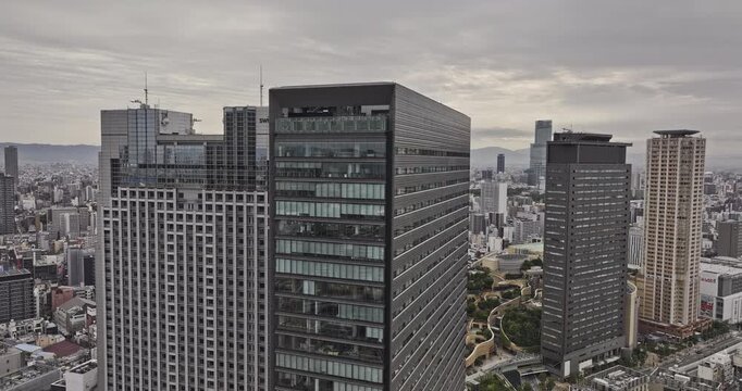 Osaka Japan Aerial v125 flyover Namba capturing a cluster of shopping malls, major railway station and commercial buildings under an overcast sky - Shot with Mavic 3 Pro Cine - Oct 10th 2023