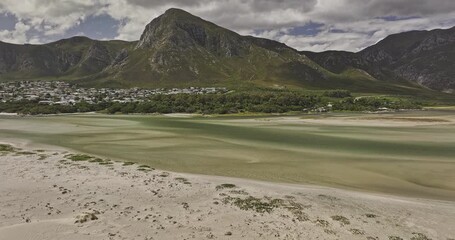 Hermanus South Africa Aerial v2 flyover capturing Klein River Lagoon estuary, Grotto Beach with a town nestled at the base of the Kleinrivier mountains - Shot with Mavic 3 Pro Cine - Jan 8th 2024