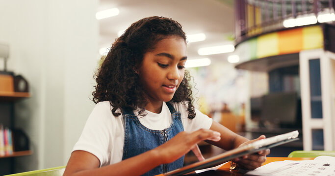 Education, scrolling or child in library with tablet, elearning or online guide for academic development. Digital, browse and girl at table with tech, homework app or guidance in remote learning.