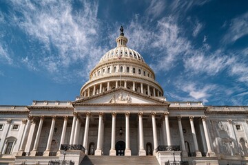 Obraz premium Majestic US Capitol Building facade and dome against a dramatic blue sky in Washington D.C.