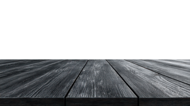 Wooden table on wooden floor with aged wall and textured planks in a vintage interior