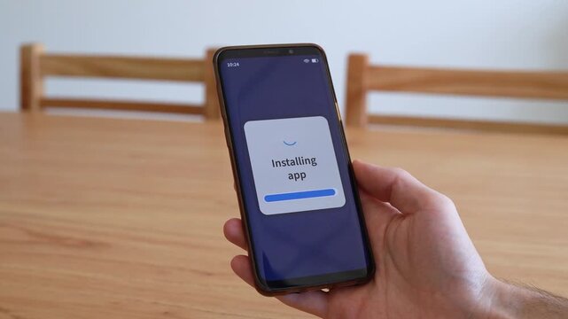 Intalling new app on your smartphone. Process of downloading new applications from the store.