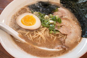 Delicious tonkotsu ramen bowl with delicious char siu above.
