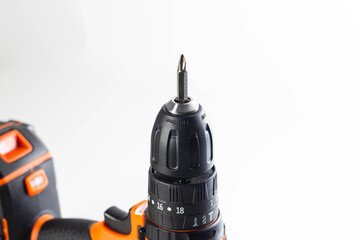 Close-up view of a cordless drill highlighting the metal bit and adjustable settings for home improvement tasks