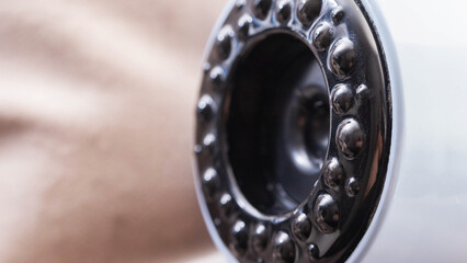 Modern vacuum anti-cellulite massager, close-up. Tightening of loose skin and cellulite, portable. Copy space for text