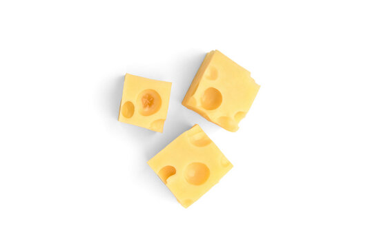 Maasdam cheese cubes isolated on white background.