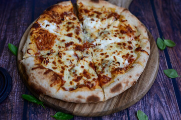 Home made classic Wood fired oved   Italian Pizza  quattro formaggi  Pizza with melted parmesan, gorgonzola, mozzarella and gouda  