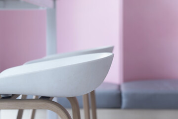 A white chair placed inside a café on a holiday