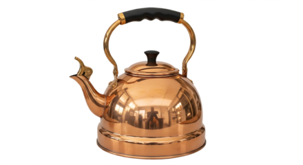 A shiny copper tea kettle with a black handle and spout against a black background in a studio shot