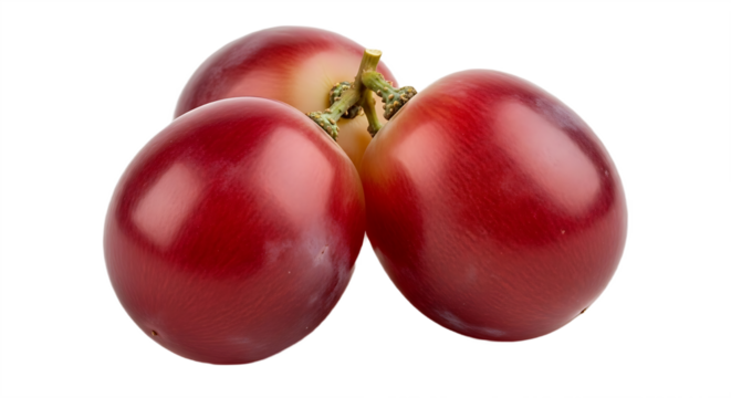 A close up of three red grapes clustered together on a black background in a studio setting