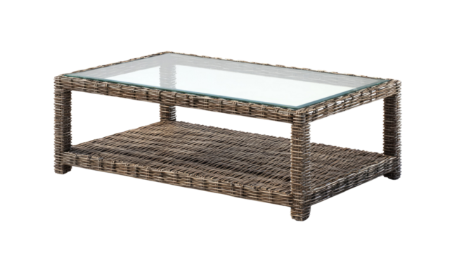 A rectangular outdoor coffee table made of woven grey rattan with a clear glass top and a lower storage shelf, isolated. background removed