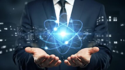 A man in a navy suit holds a glowing blue atom with a cityscape in the background, representing a modern business and technology concept. - Powered by Adobe