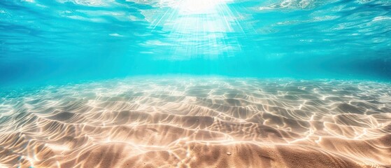 Seabed sand with blue ocean summer sun shining bright calm sea water ripples.