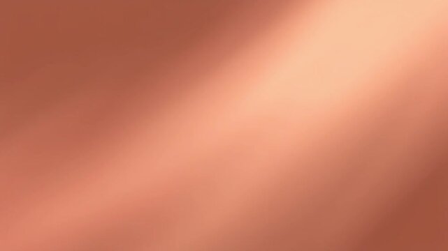 A smooth, gradient background showcases a blend of warm copper and peach tones, creating a soft, elegant design for various creative projects.
