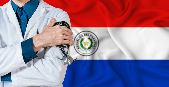 Paraguay healthcare concept. Doctor with stethoscope on Paraguay flag. Doctor holding stethoscope on Paraguayan flag