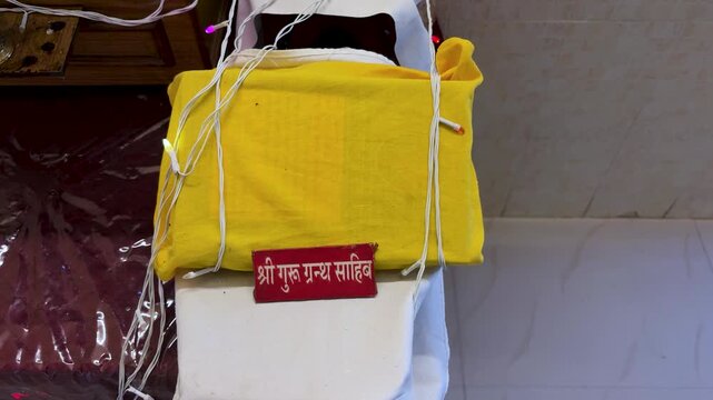 covered Guru Granth Sahib the holy scripture of Sikhism during religious ceremony