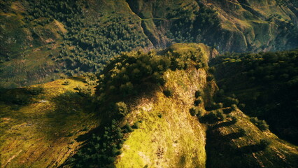 Serene hills covered with vibrant greenery stretch across vast valleys under a clear blue sky. The sun casts soft shadows, highlighting the beauty of natures untouched landscape.