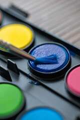 Macro Shot of Watercolor Painting with Brush
