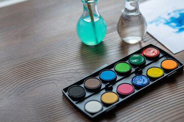 Macro Shot of Watercolor Painting with Brush
