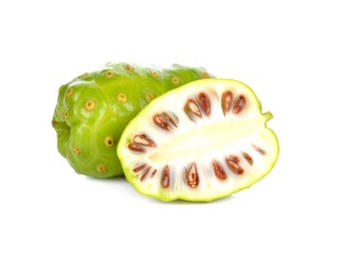 Fresh noni fruit cut open showing seeds on white